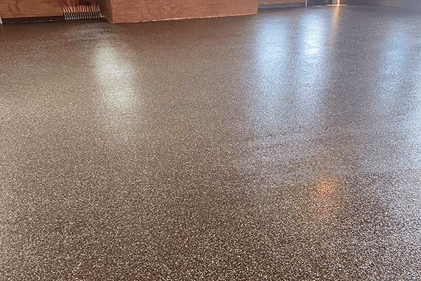 Best heavy duty garage flake epoxy floor in terra cotta colors. Installed by Young Flooring in Winston-Salem.