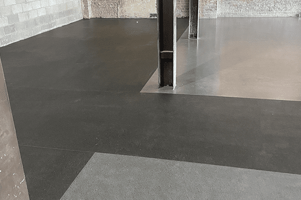 commercial epoxy flake floor installation in auto shop by young flooring