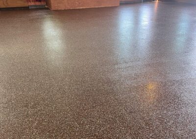 terra cotta colored polyaspartic flake floor installation by young flooring