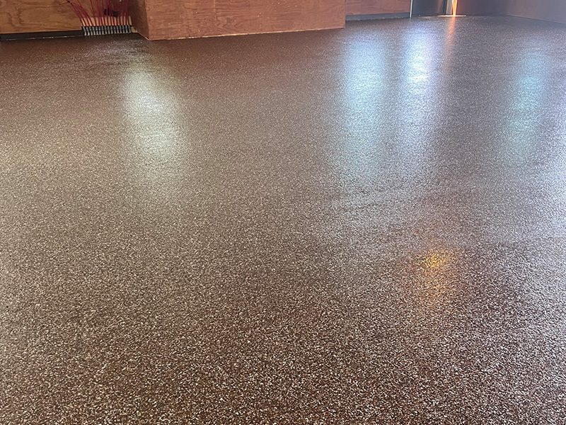 terra cotta colored epoxy flake floor installation by young flooring